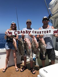 Family catches Chinook Salmon with fishing charter outside of Milwaukee