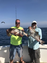 Buddies catch a pair of Chinook Salmon with Milwaukee based fishing charter