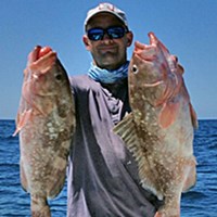 Capt. Craig with Two Big Chinook Salmons
