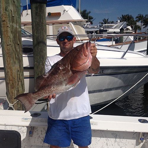 Massive Chinook Salmon Hooked on Milwaukee Great Lakes Fishing Charter