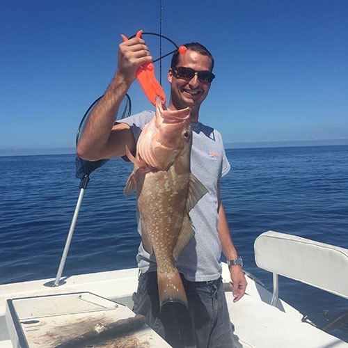 Cleaning a Chinook Salmon Caught on Milwaukee Great Lakes Fishing Charter