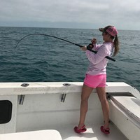 Fighting Against a Brown Trout on a Milwaukee Fishing Charter