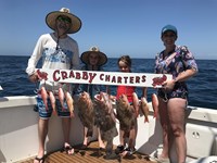 Family on Fishing Charter in Wisconsin with Lake Trouts