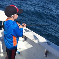 Young Angler Catches Fish