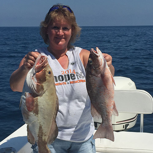 Pair of great Lake Trout caught on this guest's first Great Lakes fishing charter Lake Trout and Chinook Salmon Caught on Milwaukee Great Lakes Fishing Charter